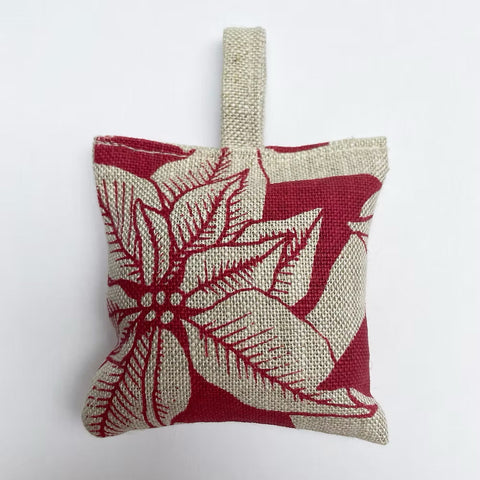 Oatmeal coloured Irish Linen with red floral pattern on grey background