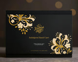 The Handmade Soap Company Indulgent Hand Care Gift Set. A black box with gold and white floral designs and 'The Handmade Soap' branding.