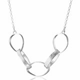 Silver necklace with a unique pendant design on a white background